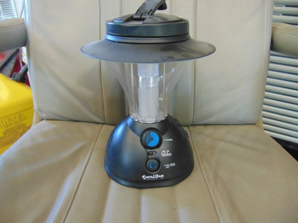lot 167 image: Battery Powered Light and Radio Combo AND (3) Pair of Sun Glasses