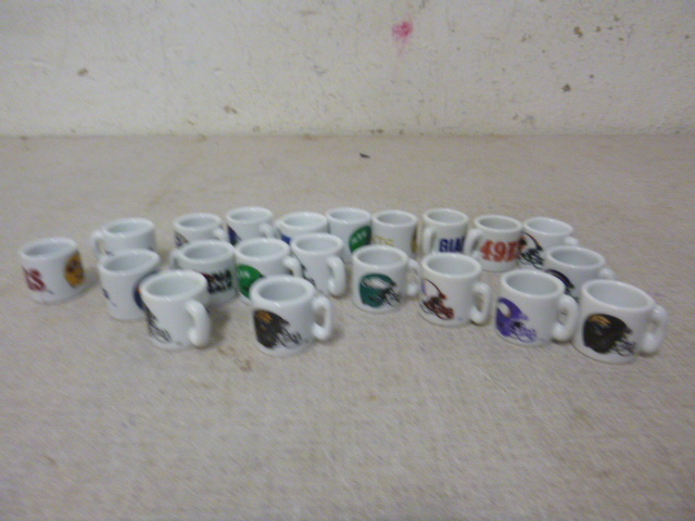 lot 98 image: 21 Miniature NFL Coffee Mugs