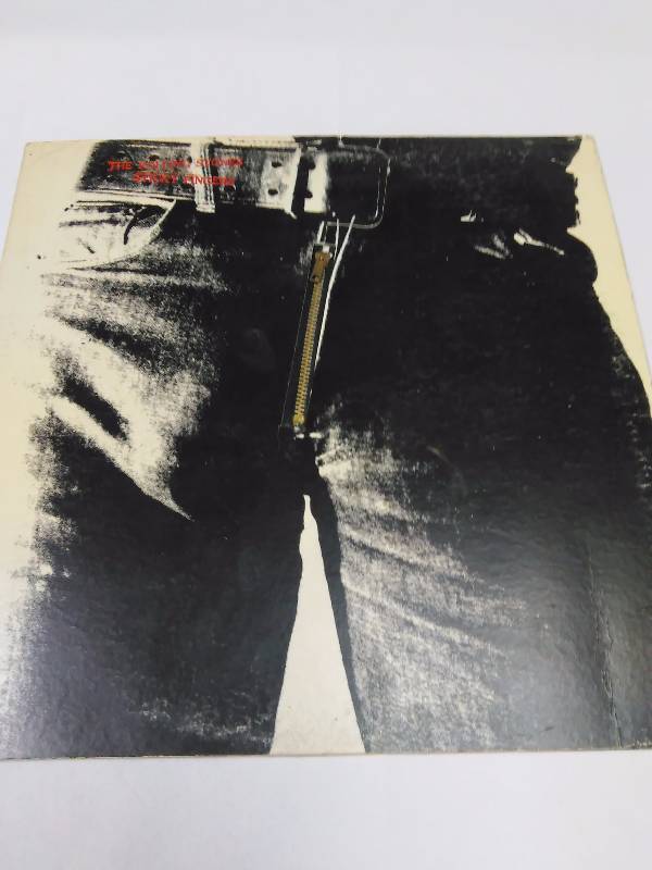 lot 3 image: The Rolling Stones, Andy Warhol Art (1) Sticky Fingers with working zipper and belt buckle.  Song 3 Wild Horses has a pop.