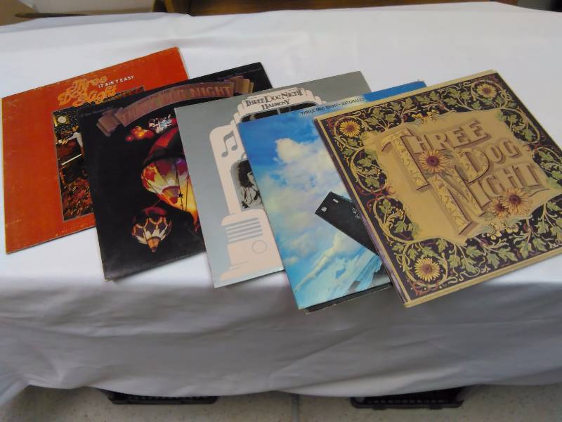 lot 14 image: Three Dog Night (5) It Aint Easy, Around the World with Three Dog Night (2 record set), Three Dog Night Harmony, Seven Separate Fools including giant playing cards, and Naturally