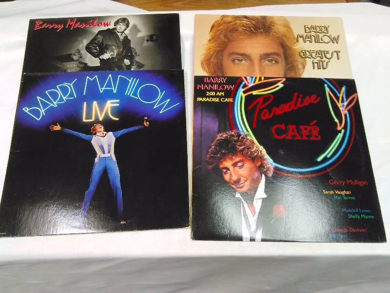 lot 47 image: Barry Manilow (4)  Here Comes the Night, Barry Manilow Live (2 albums), 2 A.M. Paradise Caf, and Barry Manilow Greatest Hits (2 albums)