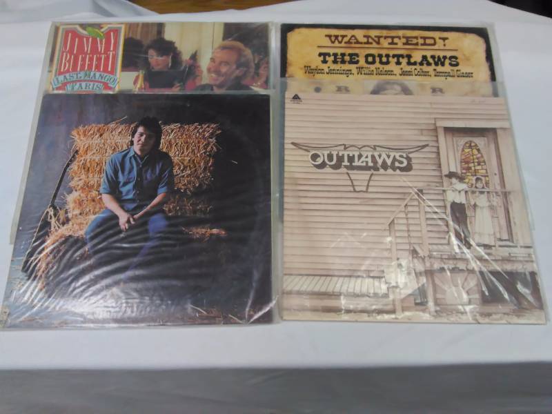 lot 76 image: Country Albums (4) Jimmy Buffet (Last Mango in Paris) , John Prine (self-titled) The Outlaws (2)