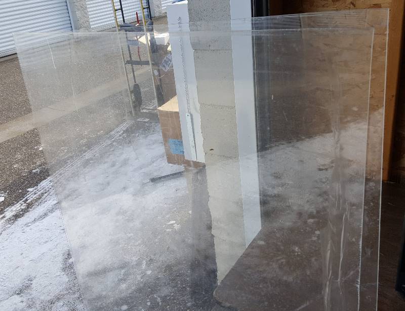 Two large pieces of plastic & peg board