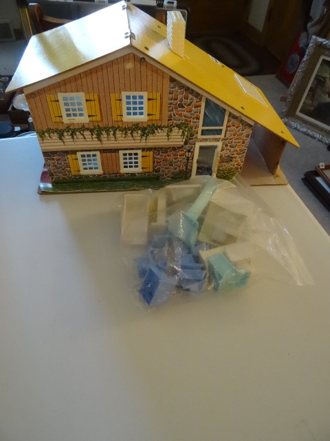 lot 18 image: 1970s doll house with plastic furn...