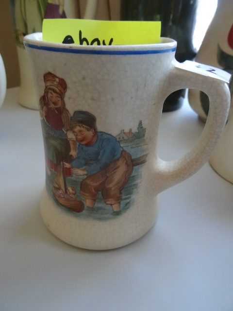 lot 82 image: Roseville pottery dutch mug. 111-3....
