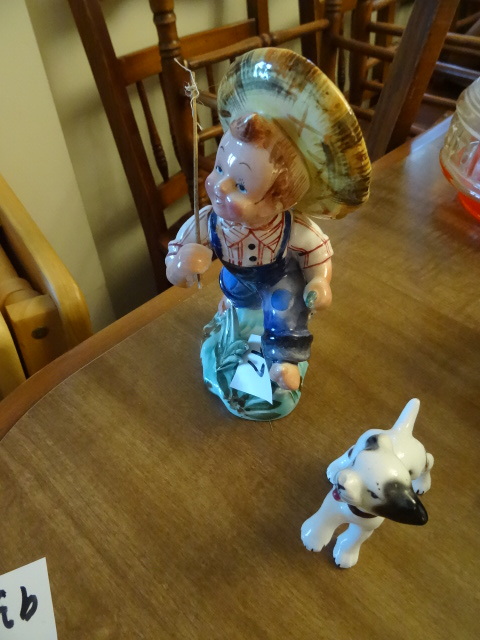 lot 97 image: Little boy with fishing rod and Pup...