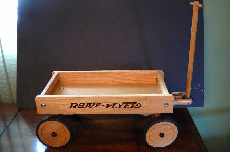 lot 23 image: Decorative Radio flyer Wagon 18 l x 8 w x 8 tall