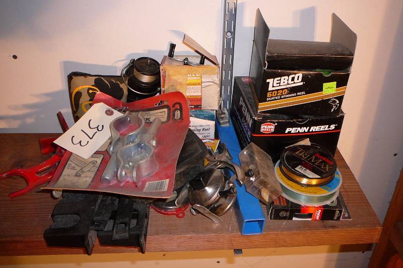 lot 373 image: Lot of Fishing, Oar Locks , Motor lock, Rod Holder, Misc. lead Weights, Misc. Reels