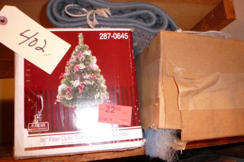 lot 402 image: Christmas Tree, Rug, Roll Filler furnace