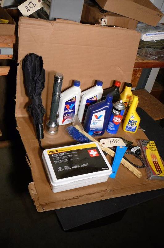 lot 448 image: First Aid Kit unopened, Oil, Flashlight, Safety Glares, White Grease, Heet,ATF power Steering Fluid