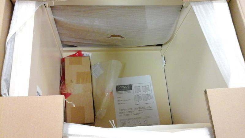 Cottage 24 in. W x 21-58 in. D x 34 in. H Vanity Cabinet Only in Antique White side wall is slightly detached easy to fix see pictures