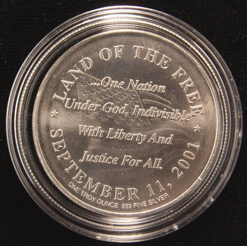 lot 10 image: 1 TROY OZ. .999 FINE SILVER 9-11 SILVER ROUND IN AIRTITE HOLDER