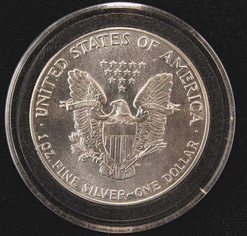 lot 28 image: 1986 AMERICAN SILVER EAGLE 1 TROY Oz. .999 FINE SILVER DOLLAR IN AIRTITE HOLDER