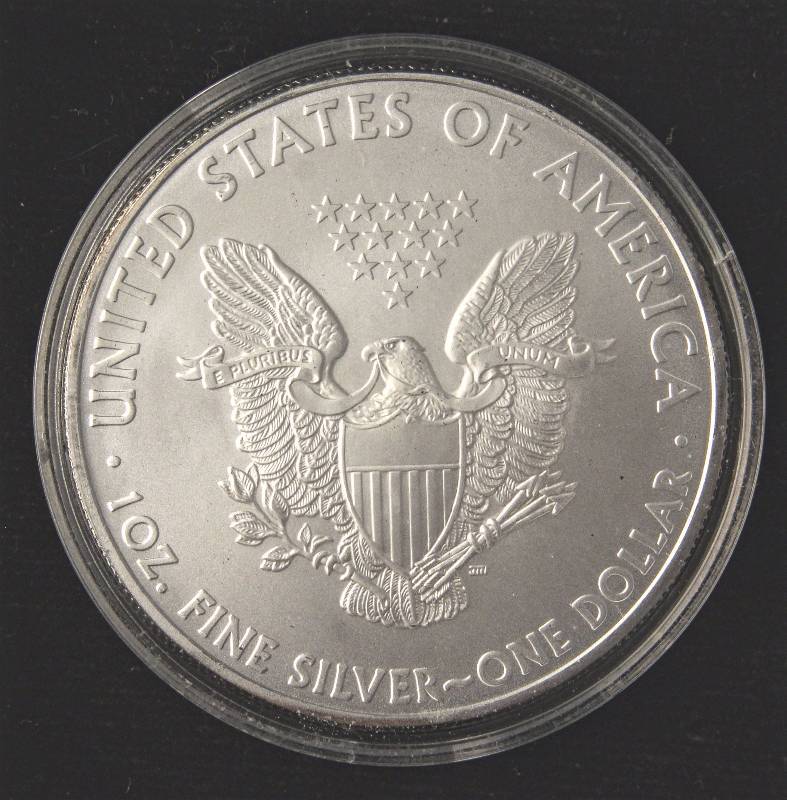 lot 48 image: 2010 AMERICAN SILVER EAGLE 1 TROY OZ. .999 FINE SILVER DOLLAR IN AIRTITE CAPSULE