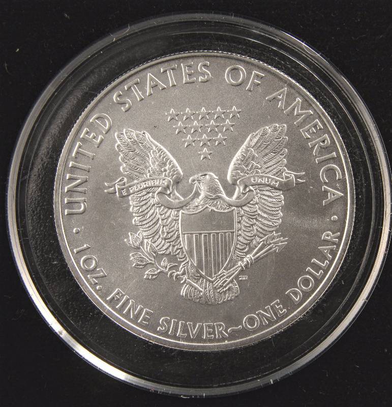 lot 69 image: 2009 AMERICAN SILVER EAGLE 1 TROY OZ. .999 FINE SILVER DOLLAR IN LITTLETON HOLDER