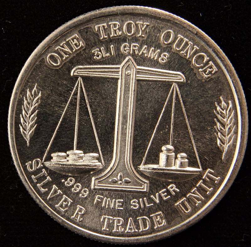 lot 74 image: 1 TROY OZ. .999 FINE SILVER VINTAGE EAGLE-FLAG SILVER TRADE UNIT