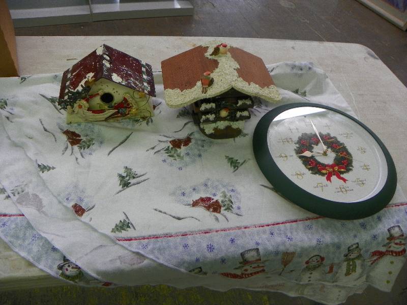 Two seasonal bird houses, table cloth and clock