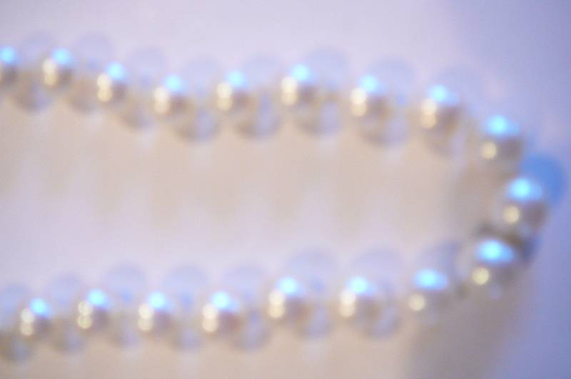 Necklace tied between pearls and Earrings