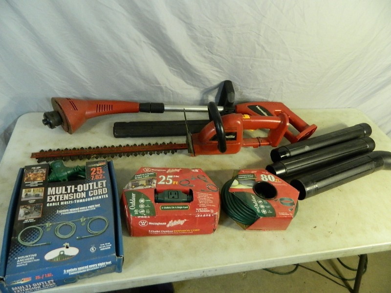 lot 40 image: Cordless Yard Tools and New Extension Cords