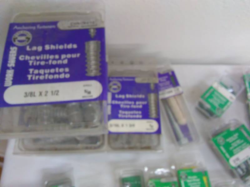 lot 59 image: Large Lot of Wall Fasteners (100 pkgs.) See Desciption for more detail.