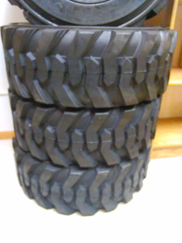 lot 2 image: Skid Loader Tires (4) 10-16.5 N.H.S. Allied RBT