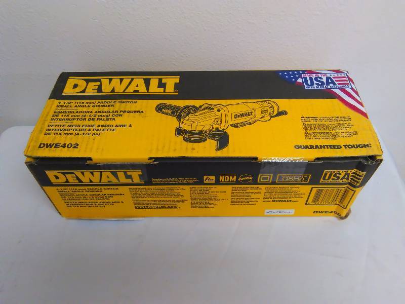 lot 25 image: DeWalt 4.5 inch, paddle switch small angle grinder Model DWE402