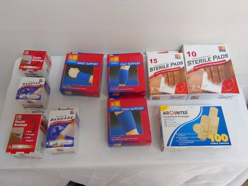 lot 37 image: First Aid Supplies Band aids, supports, gauze and pads (10 units in all)