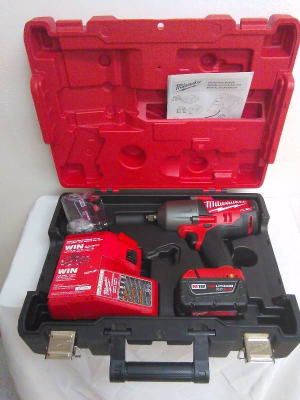 lot 101 image: Milwaukee M18 Fuel, - inch, high torch impact wrench with friction ring kit Model 2763-22
