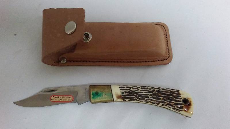 lot 226 image: Stainless Pocket Knife with leather carry pouch
