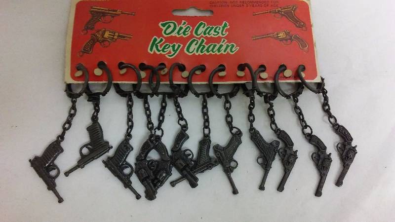 lot 231 image: Vintage Die Cast Pistol Key Chains (12)