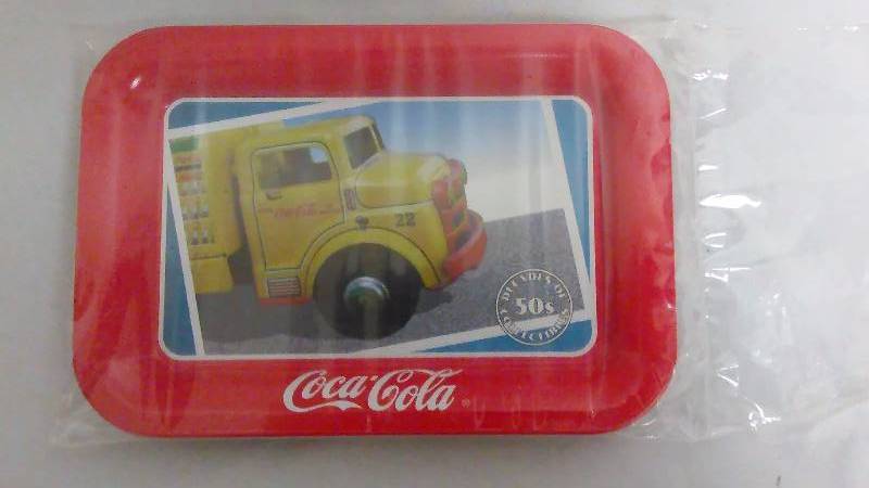 lot 561 image: Sealed Coca Cola Advertising Trays, set of 4, Manf. In 1989, measure 6.5 x 4.5 inches
