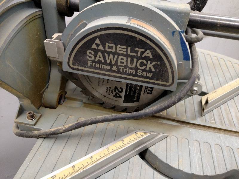 lot 101 image: Delta Sawbuck Frame & Trim Saw, Wor...