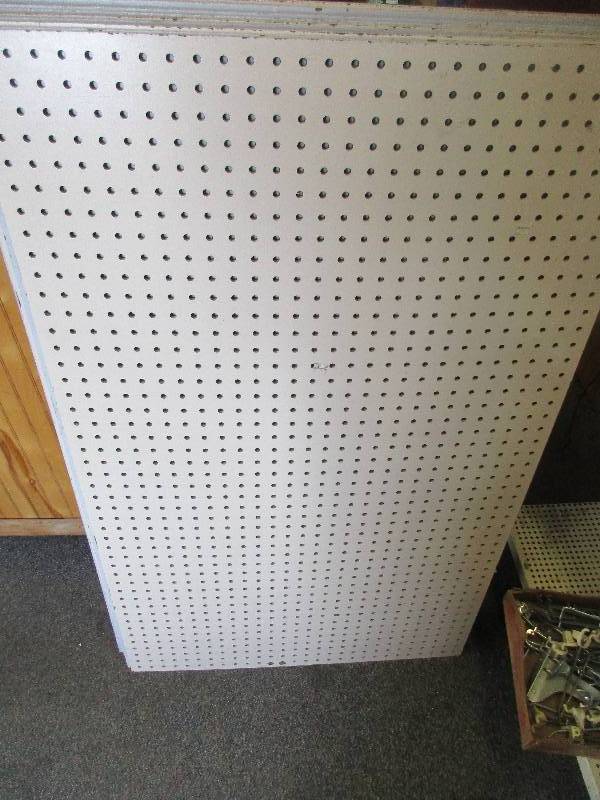 12 sheets of peg board and box of pegs