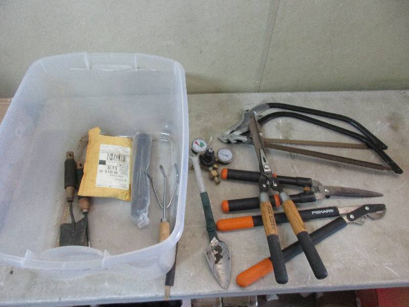 tote of yard care tools