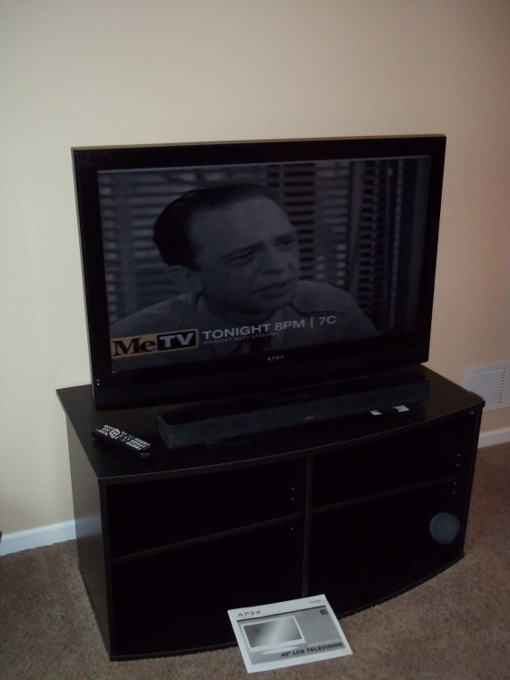 lot 25 image: 40 TV with Sound Bar and Stand, Tested and works