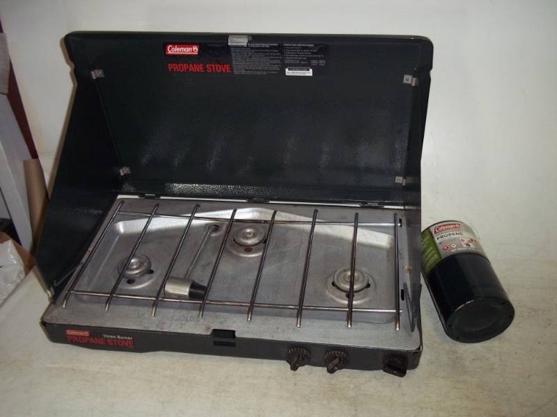 lot 119 image: Coleman 3 burner propane stove with bottle of propane
