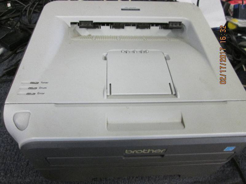 lot 84 image: Brother HL Laser printer powers on...