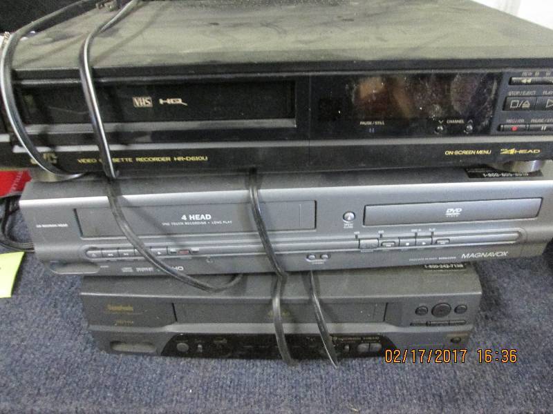 lot 85 image: 2 VHS and 1 vhsdvd player powers o...