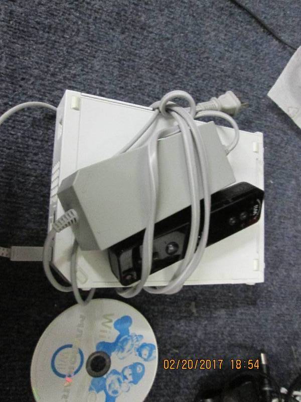 lot 115 image: white wii powers up and had mario c...