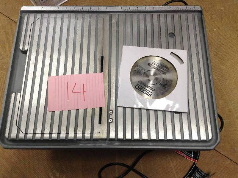 lot 14 image: RIDGID 7 in. Job Site Wet Tile Saw Model#  R4020  in working conditions