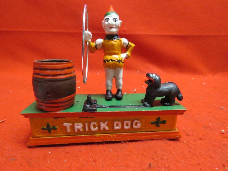 lot 224 image: Design Toscano Circus Clown and Trick Dog Authentic Foundry Iron Mechanical Bank