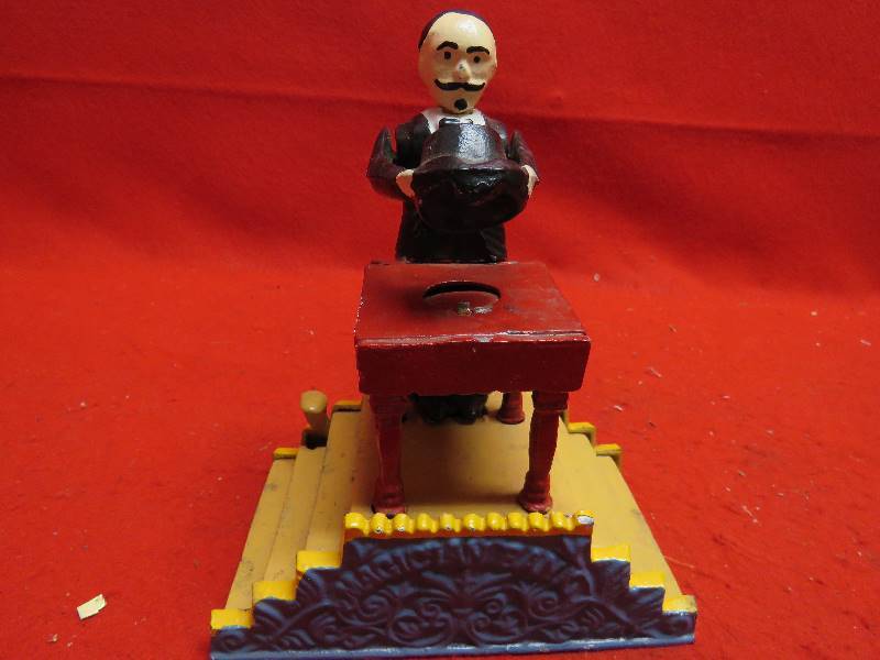 lot 228 image: Magician Mechanical Cast Iron Bank