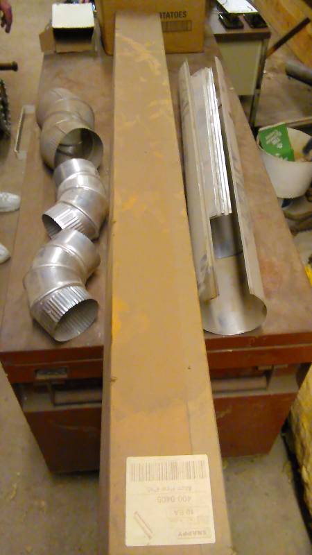 lot 109 image: Snappy Pipe 4inch by 5 foot (3) and 4-inch elbow, 5-inch elbow, 4 inch 2 and 3 ft.
