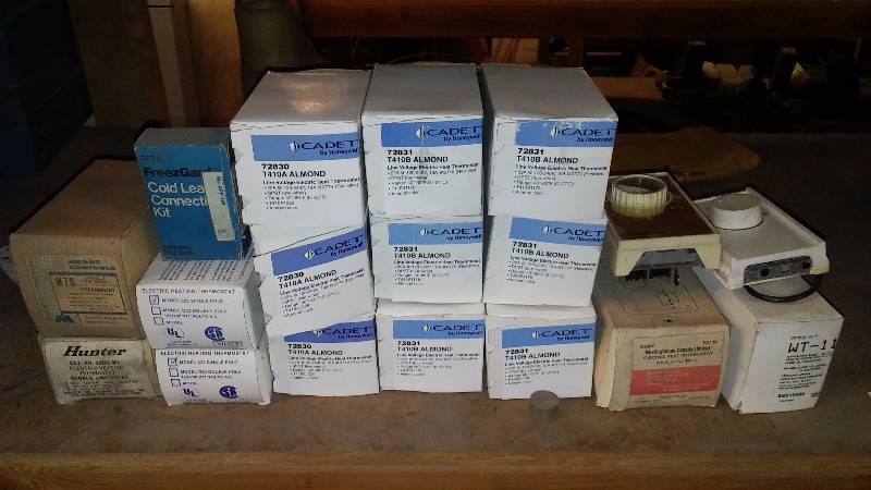 lot 452 image: Cadet Line Voltage Electric Heat Thermostat (9) and misc. thermostats