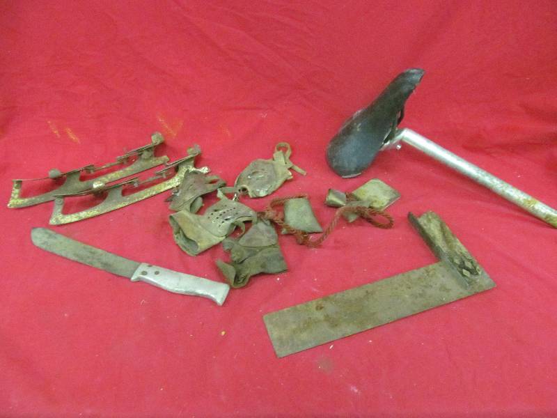 lot 66 image: Antique ice skates, corn shucking gloves