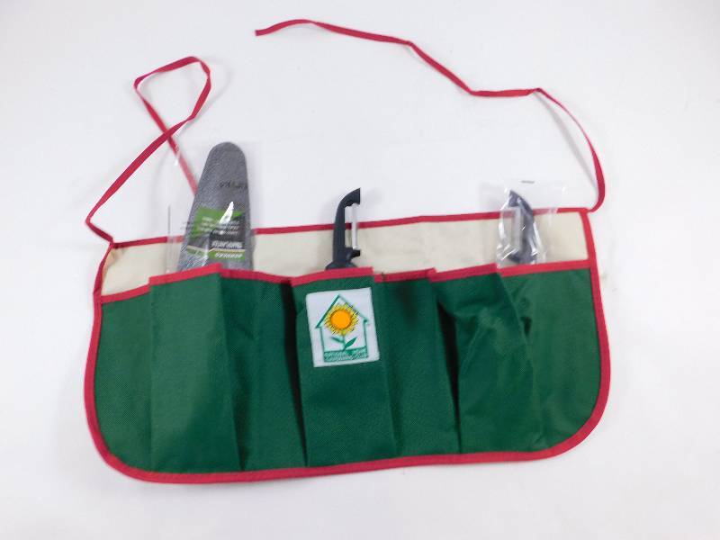 lot 50 image: Gardening Tools - Apron, 2 Peelers, Transplant Shovel