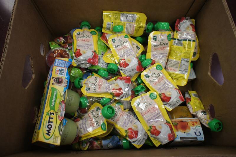 lot 170 image: Lot of Approximately 50 Pieces of Assorted Apple Sauces and Yogurts - Dates Range
