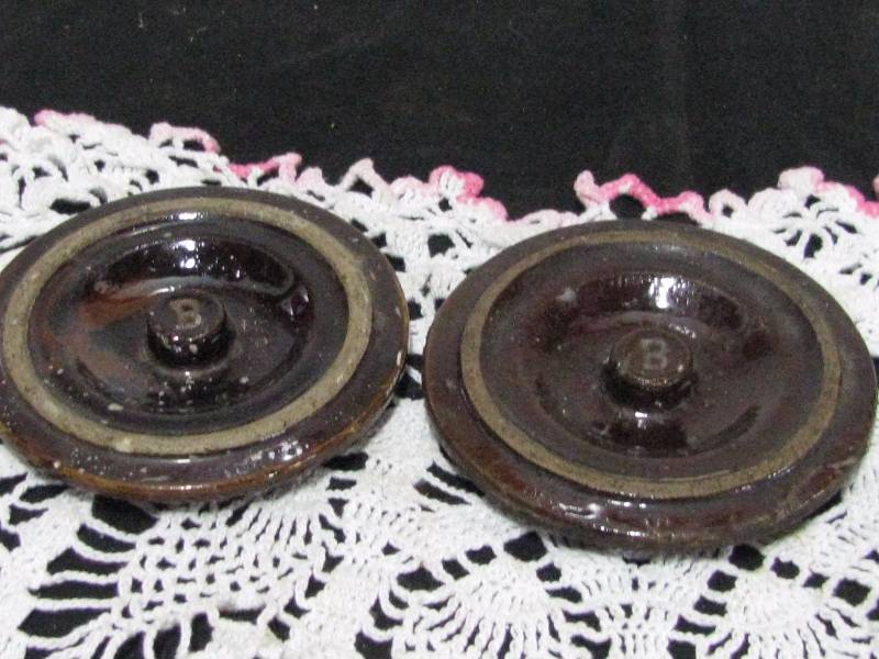 lot 78 image: Small Slip Glaze Crock Lids