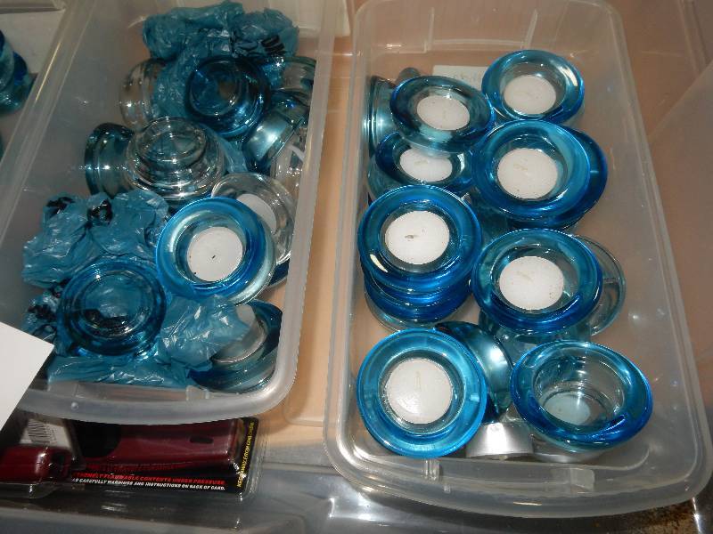 lot of blue glass candle holders with 3 lighters