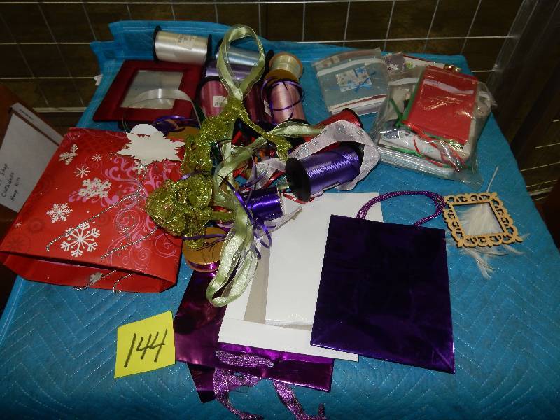 lot 144 image: Large lot of Ribbon and other packaging items as pictured